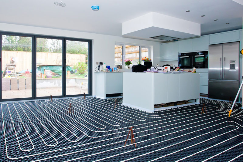 Photograph of domestic underfloor heating being fitted